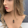 Raw tourmaline in matrix pendant