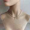 14-karat gold rhodochrosite hamsa hand necklace