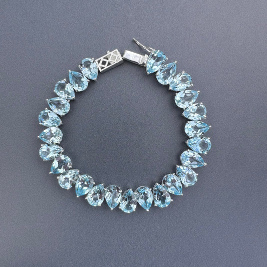 925 sterling silver blue topaz pear-shaped tennis bracelet