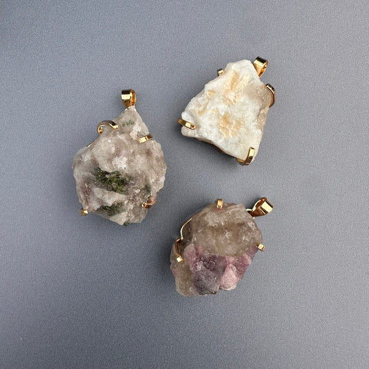 Raw tourmaline in matrix pendant