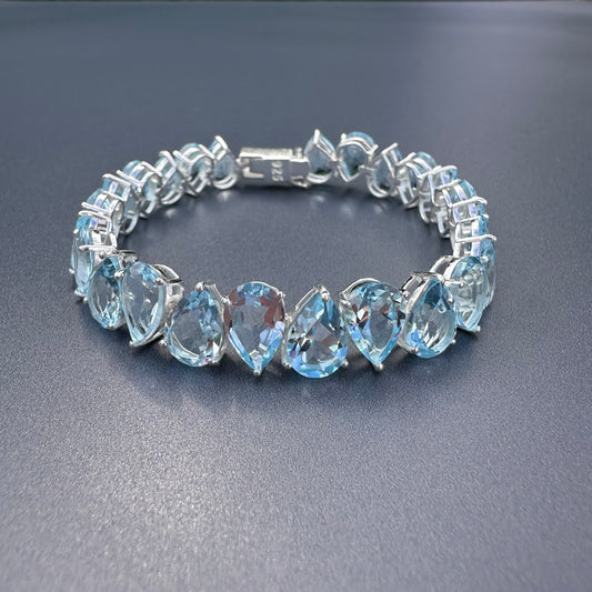 925 sterling silver blue topaz pear-shaped tennis bracelet