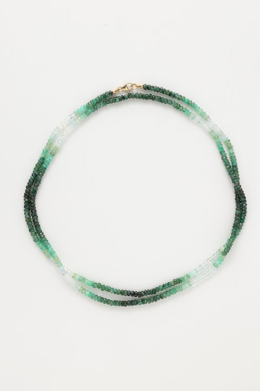 14-karat gold shaded emerald double wrap necklace