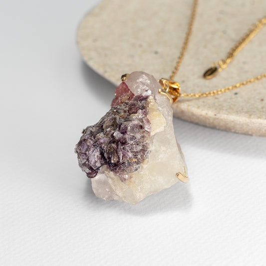 Raw tourmaline in matrix pendant