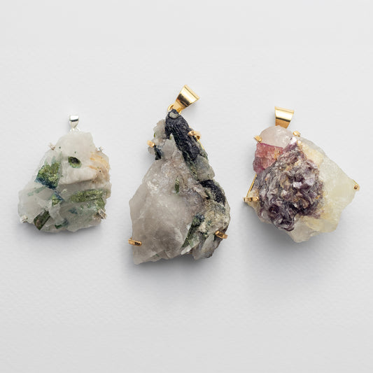 Raw tourmaline in matrix pendant