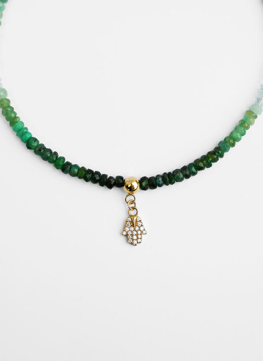 14-karat gold emerald anklet with moissanite hamsa hand charm