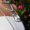 Oversized freeform faceted crystal quartz pendant